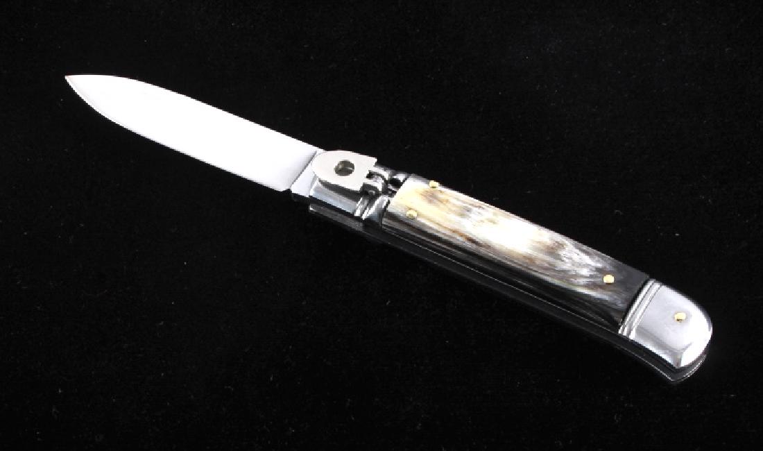 German Buffalo Horn Lever Lock Switchblade Knife: This is a high quality, hand crafted German buffalo horn lever lock switchblade knife. The knife has a stainless steel blade and features a genuine buffalo horn handle with nickel silver bolsters. The