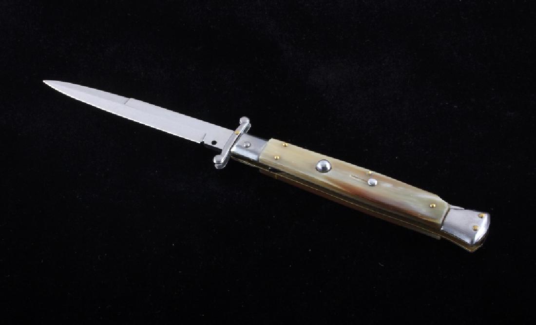 Frank Beltrame Brazil Horn Swinguard Switchblade: This is an Italian made Frank Beltrame Brazilian horn swinguard switchblade knife. The knife features a bayonet style blade marked "Frank B." with genuine Brazilian horn grips and nickel silver bolste