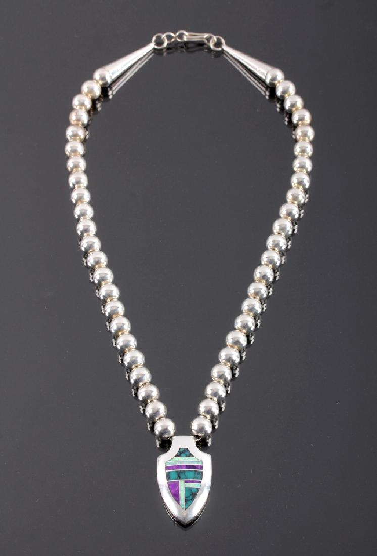 David Rosales Navajo Sterling Silver Necklace: This is a signed Navajo Native American Indian sterling silver necklace made by renowned silversmith David Rosales. Today, Rosales owns and operates the Supersmith gallery in Gallup, New Mexico. The s