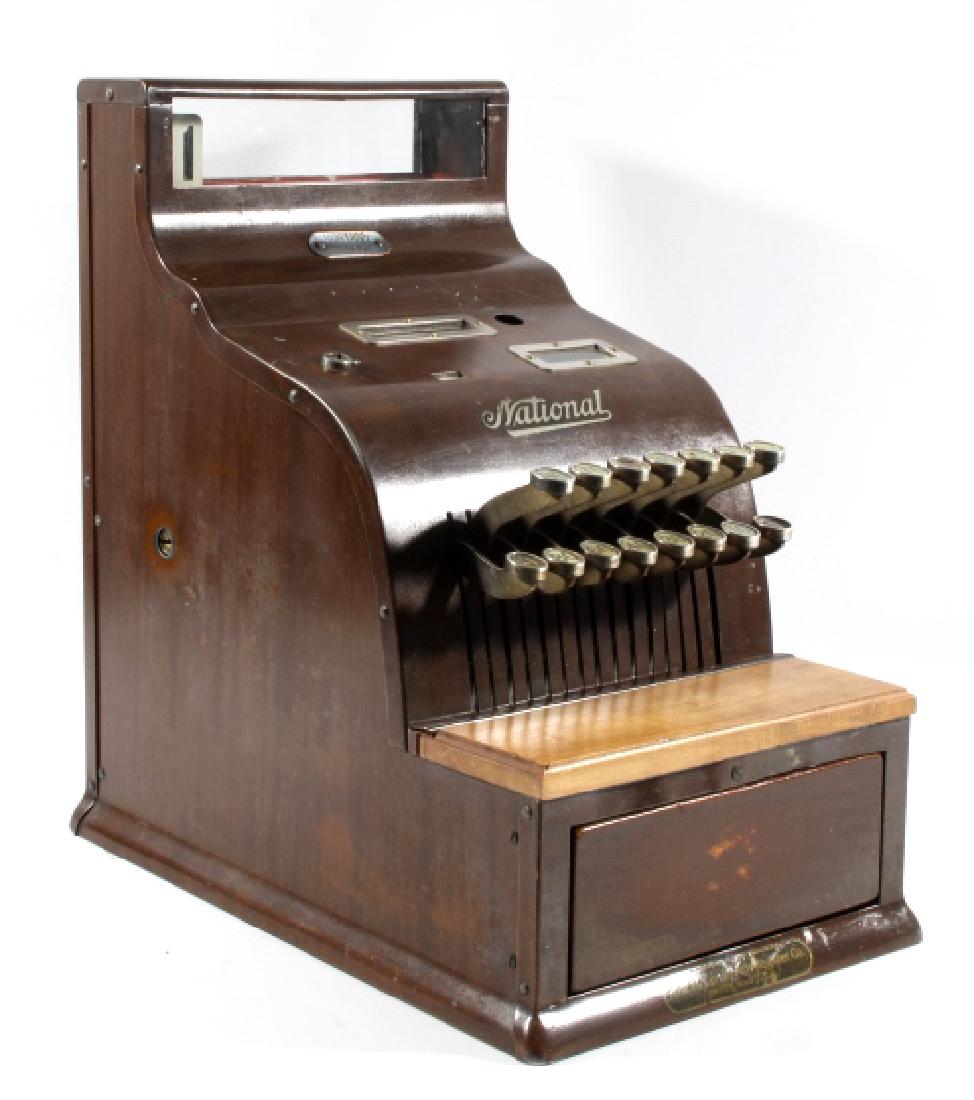 National Cash Register Model 211 Circa 1930: Included for auction in this lot is an antique candy shop register, a Model 211 National Cash Register Company, originating from 1930. The register is constructed of sheet steel, and displays a wonder