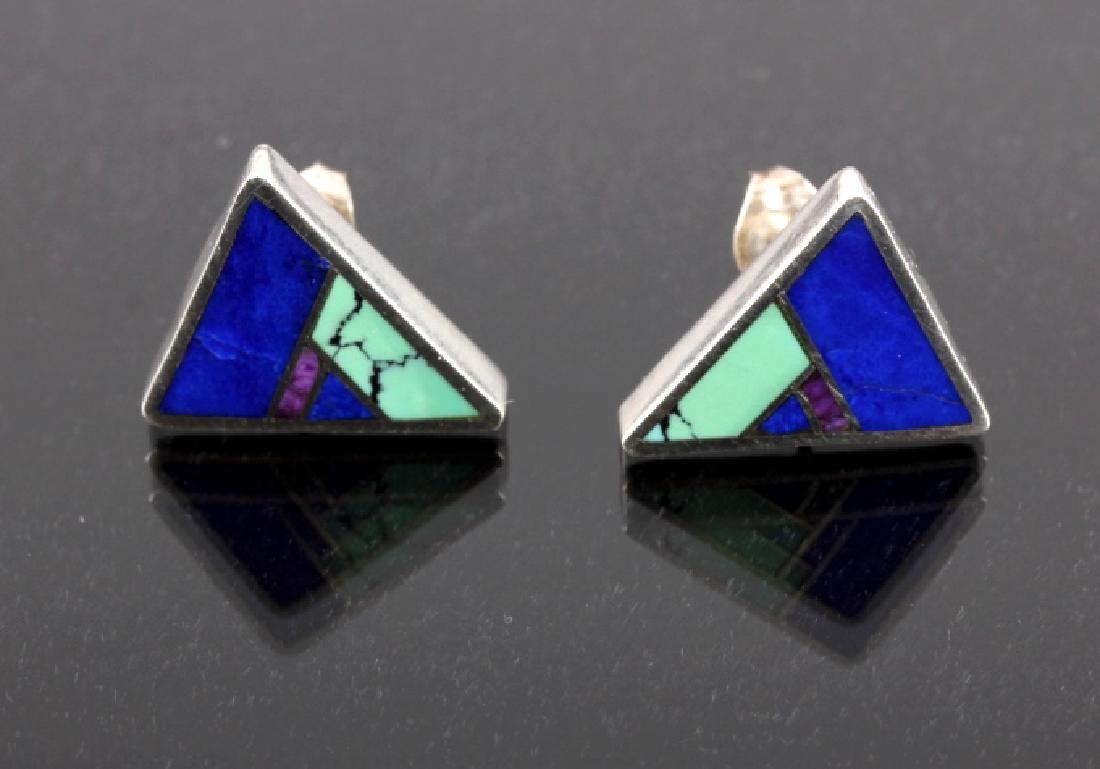 Ray Tracey Navajo Sterling Silver Arrow Earrings: This is a pair of Ray Tracey Navajo Native American Indian sterling silver earrings. The earrings show a fantastic arrow form made from solid sterling silver inlaid with lapis, sugilite and #8 Mine Tu