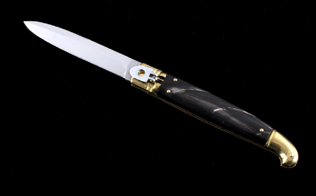 Foxinox Italian Stiletto Switchblade Knife Buffalo: This is a Foxinox Italian made stiletto switchblade knife. The knife has a lever lock switch to open and close the bayonet style blade and features a genuine buffalo horn handle set with brass bolster