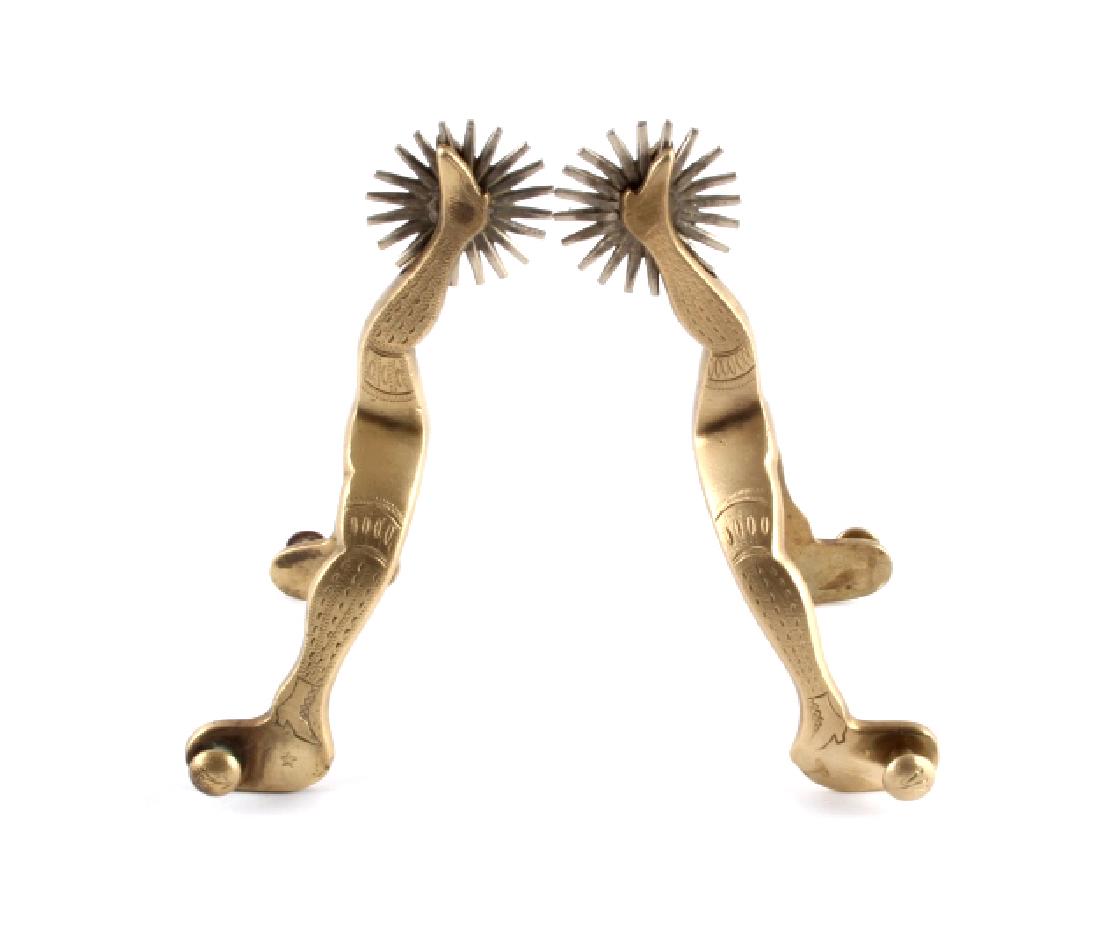 Buermann Hercules Bronze Gal Leg Spurs: This is a pair of Buermann Hercules Bronze gal leg spurs. The spurs are made from solid bronze and feature the gal leg figure on the heel band and shank. Each spur is marked with the Buermann Star and