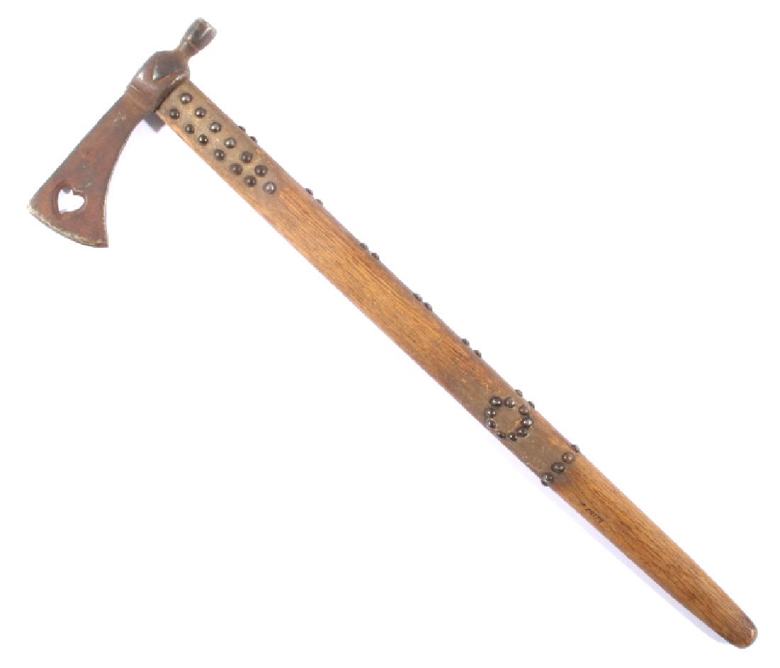 Plains Indian French Trade Pipe Tomahawk: Offered to you in this lot is a Plains Native American Indian pipe tomahawk. The piece shows a heavy duty steel head, with a French heart cut out of the blade. The handle of the axe shows decorative s