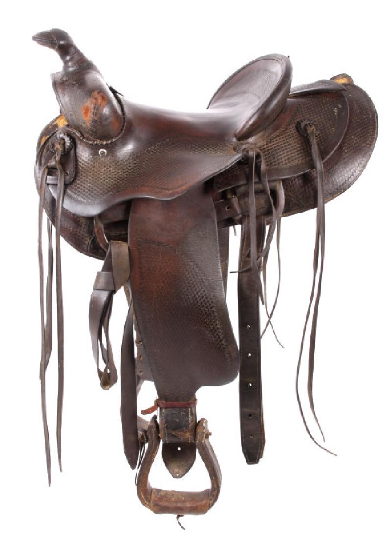 Santa Fe, New Mexico Custom Tooled Saddle: For bidding in this lot is an antique saddle out of Santa Fe, New Mexico. The saddle shows dark brown leather, with a supple, hydrated finish. The saddle shows intricate tooling on the seat back, pomm