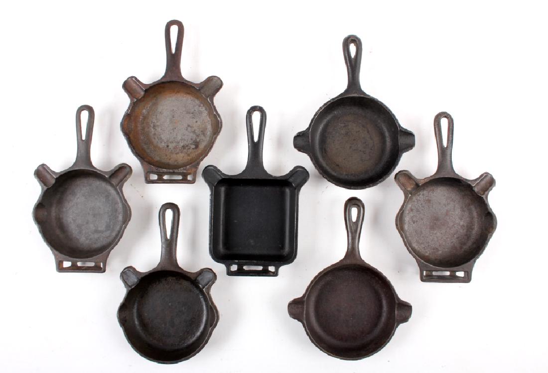 Collection Of Griswold / Wagner Cast Iron Ashtrays: For your consideration is this collection of Griswold and Wagner Ware cast iron skillet ashtrays. Starting with the Wagner Ware ashtrays, not much could be found regarding age. Both are marked "Wagner