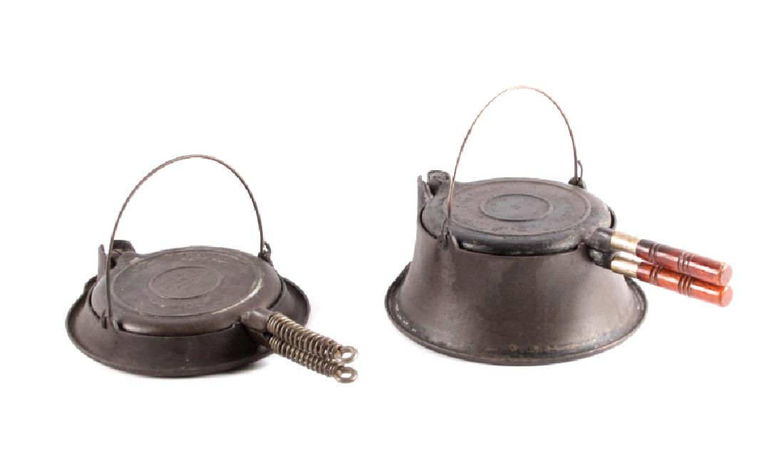 Antique set of Wagner Waffle Makers w/ Bases: For sale in this lot is a pair of size No. 8 Wagner cast iron waffle makers with their respective bases. The first of the waffle makers is marked "Wagner ware - Sidney - -O- - 1408 - PAT'D Sept. 15. 1