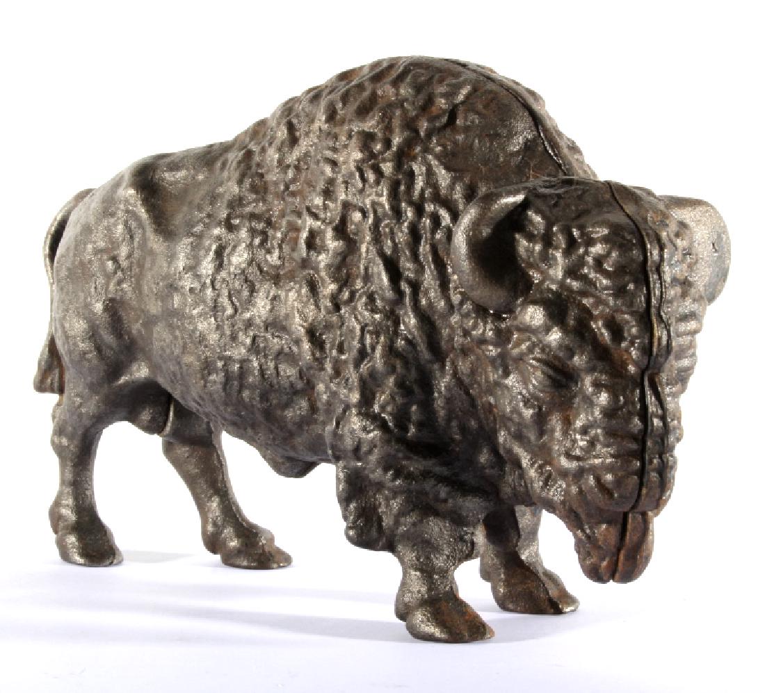 Antique Cast Iron Great American Bison Still Bank: For auction in this lot is a cast iron still bank by Art Smithy, in the form of a Great American Bison. The bank is cast in two halves, with a coin slot on top, and a central screw holding the two pie