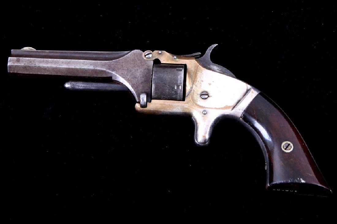 Smith & Wesson No. 1 Presentation Silver Revolver: This is a fantastic early Number 1 (No. 1) Second Issue (2nd Issue) antique tip-up single action spur trigger revolver chambered in .22 rimfire caliber, produced by Smith & Wesson circa 1868-1875. The