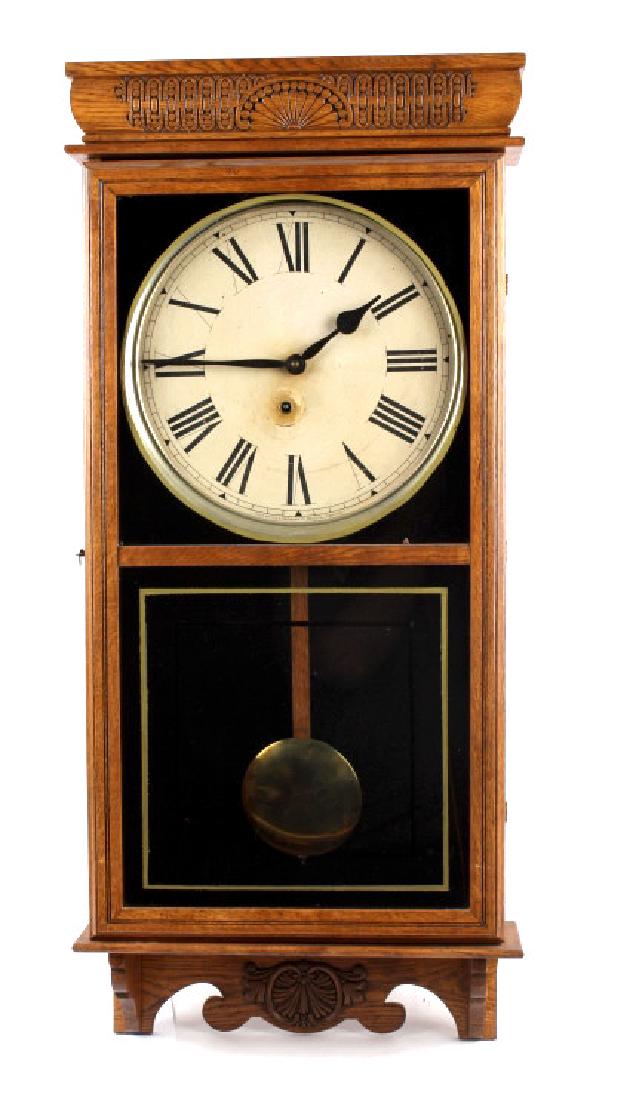 Ingraham Western Union Wall Clock: Offered in this lot we have a Ingraham Western Union wall clock manufactured circa 1885. The clock was pulled from the Victory Club, from Butte in 1966. The clock shows its original paper tag on the b
