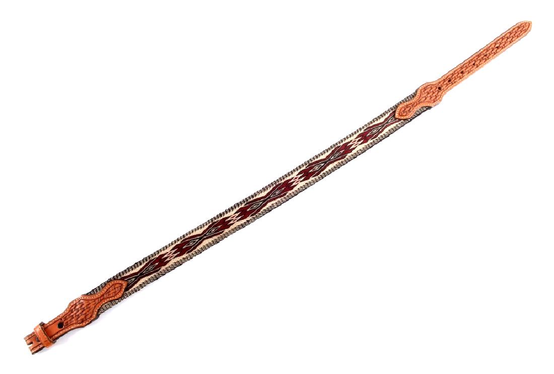 Deer Lodge Prison Hitched Horsehair Belt: This is a Deer Lodge Prison made hitched horsehair belt from Montana. The belt shows a finely hitched design in red, white and black. The ends of the belt are made from genuine leather. One end is mar