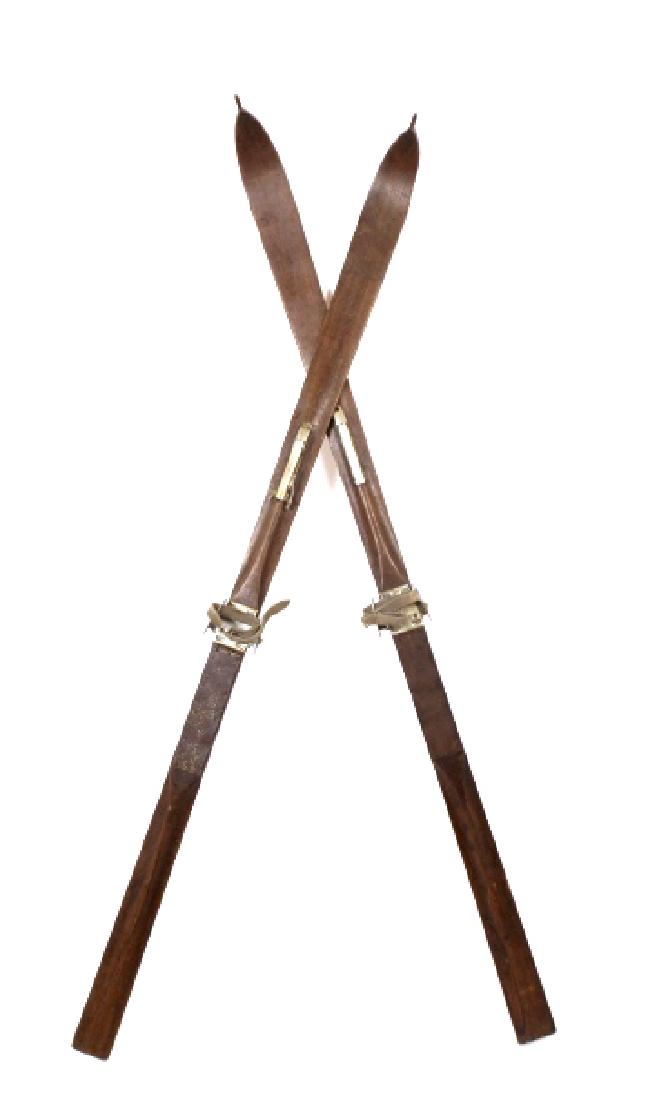 Pioneer Alpine Wooden Snow Skis: For sale in this lot we have a pair of pioneer wooden snow skis. The skis are early 1900's wooden alpine skis made that are marked "Mesta Taifuns Alpine". The skis are made of a dark stained wood with