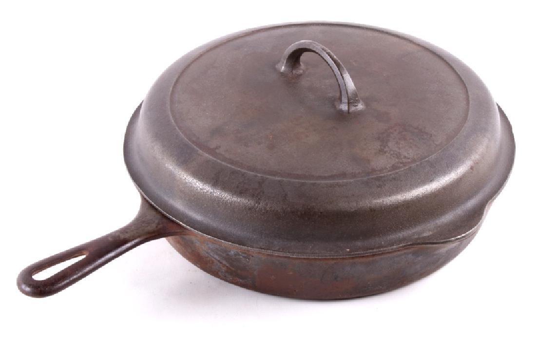 Large No. 10 Griswold Saute Pan With Lid: For your bidding consideration is this Griswold cast iron frying pan with lid. The inside of the lid is marked "No. 10/ 1100A". The small Griswold logo appears in the center. The pan is marked "10" on