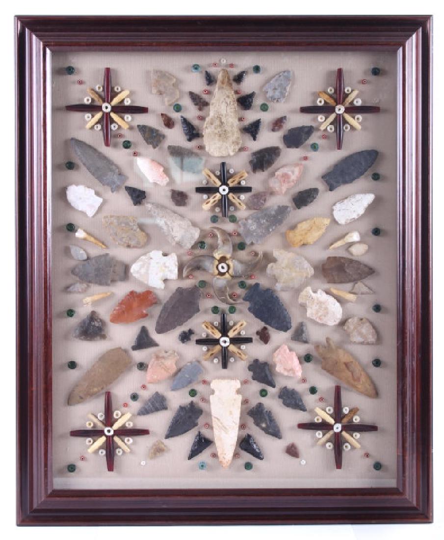 Native American Indian Arrowhead Collection: For auction in this lot is a Native American Indian arrowhead artifact display. The display is mounted in a beautiful solid wood frame, and has canvas mat. The display boasts large bear claws, Hudson