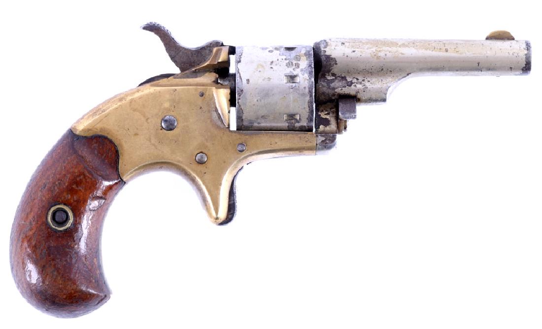 Colt Model 1872 .22 Caliber Open-Top Revolver: Featured in this lot is a Colt Model 1872 Open-Top revolver, chambered for 22 long. The Colt Open Top is a single action, 7-shot, rear loading revolver, built on a brass frame, with a nickel finish ba