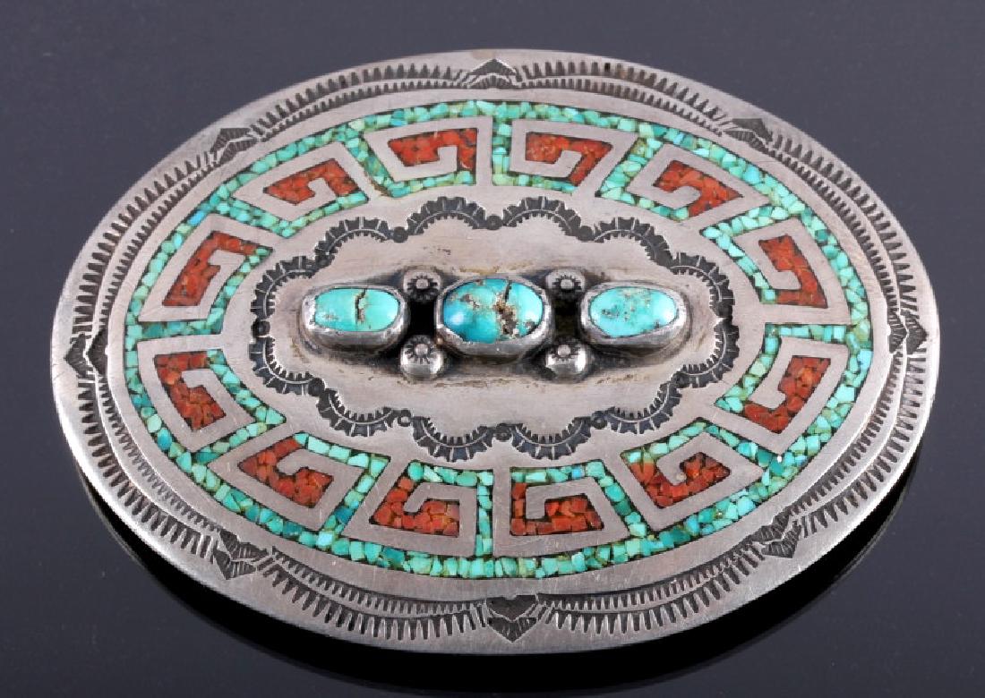 Navajo Sterling Silver Coral Turquoise Belt Buckle: This is a signed Navajo Native American Indian sterling silver with coral and turquoise belt buckle made by Juan Singer. The buckle is made from solid sterling silver showing a wonderful hand tooled a