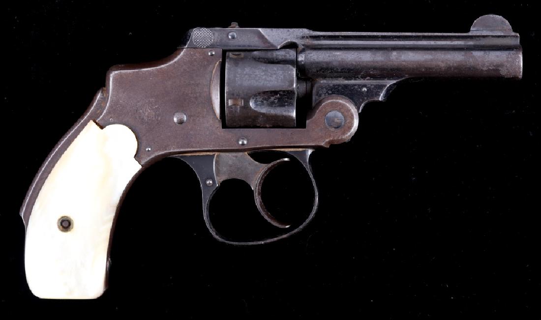 Smith & Wesson .32 Safety Hammerless Revolver: Included for bidding in this lot is a Smith & Wesson third model, safety hammerless revolver, chambered for .32 Smith & Wesson. The "Lemon Squeezer" features a 3" barrel, blue'd finish, pearl grips, a