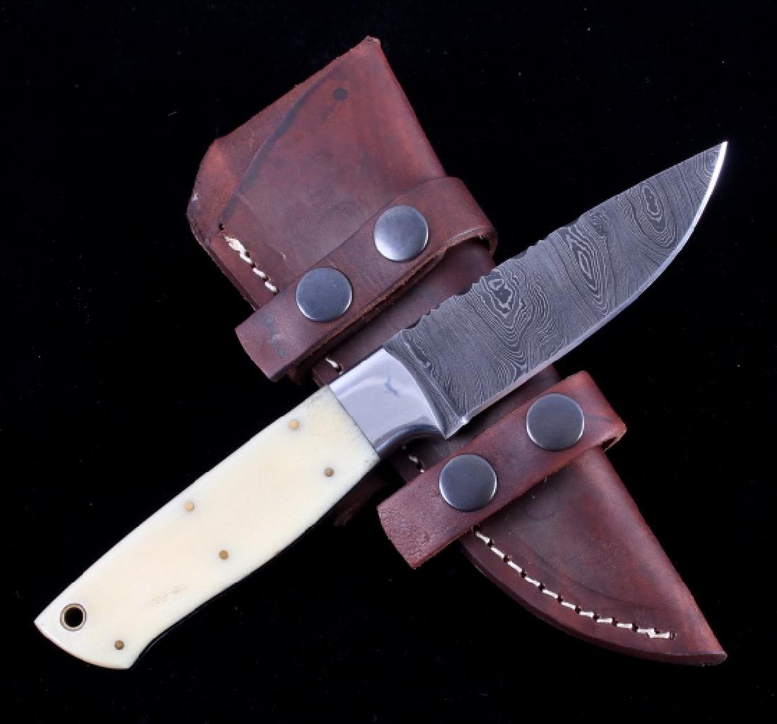CFK Damascus Exotic Camel Bone Knife & Scabbard: This is a hand crafted custom knife from CFK Cutlery Company. The knife has an excellent hand forged folded 512 Layer Twist (1095HC/15N20) polished Damascus Steel blade with a fitted beautiful exotic 