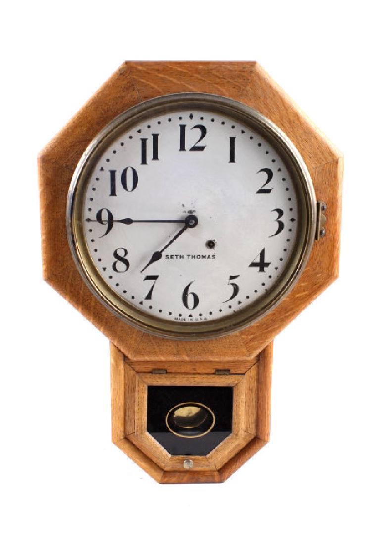 Antique Seth Thomas 1917 Regulator Clock: You are bidding this lot for a beautiful antique Seth Thomas 1917 Regulator Clock. The frame of the clock is made with an oak finish and measures at 23" long by 15 3/4" wide at the top. While the curr