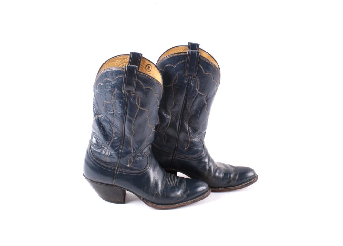 Tony Lama Men's Cowboy Boots: Featured in this lot is a pair of Tony Lama men's cowboy boots, size 8 1/2R. They are blue leather with a woven design and black heel/sole. The boots are in good condition.