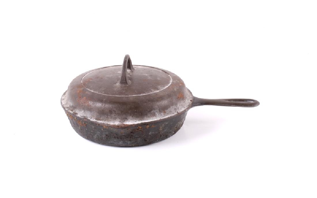 Griswold "6" Cast Iron Skillet w/ Self Basting Lid: This lot features a Griswold "6" cast iron skillet, circa 1930-1939. The skillet is marked "NO 6 GRISWOLD (logo) ERIE PA. 699 B". The skillet is in good condition for age. It measures 10" in diameter.
