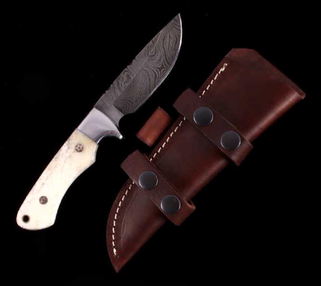 CFK Damascus Exotic Camel Bone Inlaid Horn Knife: This is a hand crafted custom knife from CFK Cutlery Company. The knife has an excellent hand forged folded 512 Layer Twist (1095HC/15N20) polished Damascus Steel blade with a fitted beautiful exotic 