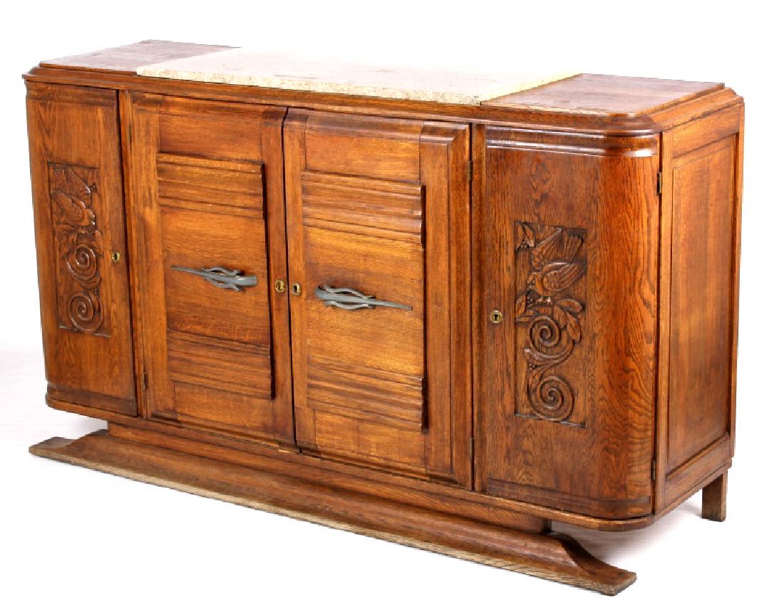 Antique Carved Oak Marble Top Sideboard Buffet: Featured on this lot we have a beautiful and elegant antique sideboard buffet cabinet. The buffet is constructed of oak with gray and tan top sheet marble. Featuring extravagant hand carved patterns o