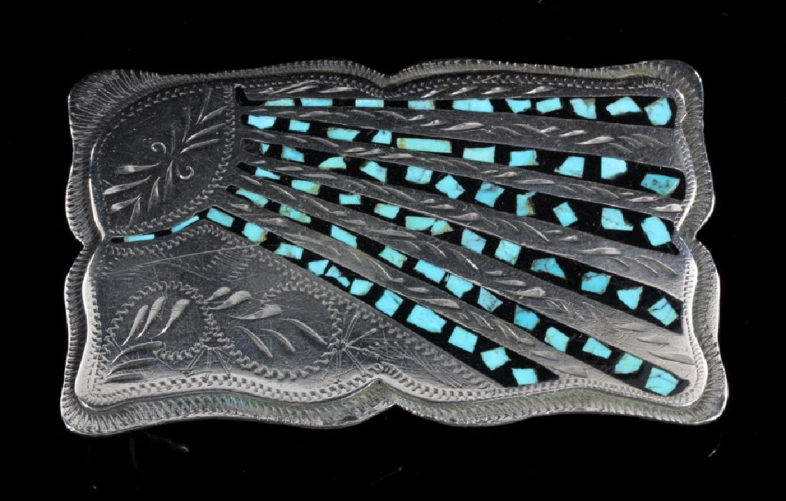 Western Flair Turquoise Chip Belt Buckle: Up for bidding is a Western Flair belt buckle with turquoise chip design. Stamped German silver on the back. This belt buckle showcases traditional western metal work and a popular turquoise chip patt