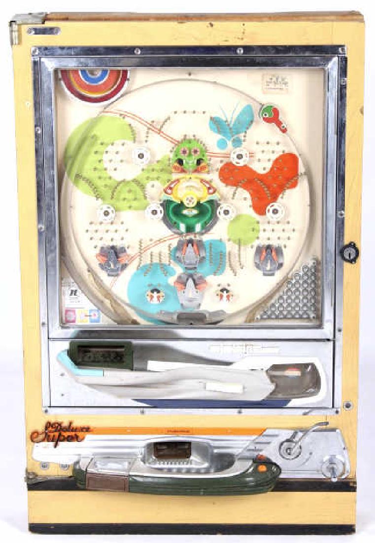 Sophia Nishijin Pachinko Machine: Featured in this lot we have a Sophia Nishijin pachinko machine. The machine has a solid wood case with a fantastic playing field. The Pachinko games were first introduced in Japan in the 1920's and b