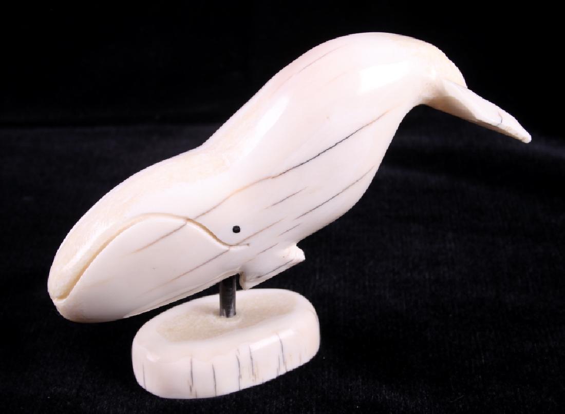 Signed Inuit Humpback Whale Walrus Tusk Carving: For your consideration is a signed Inuit Humpback Whale Walrus tusk carving. This piece is a hand carved depiction of a humpback whale. It is set on a cross cut base of walrus tusk. Signed on the unde