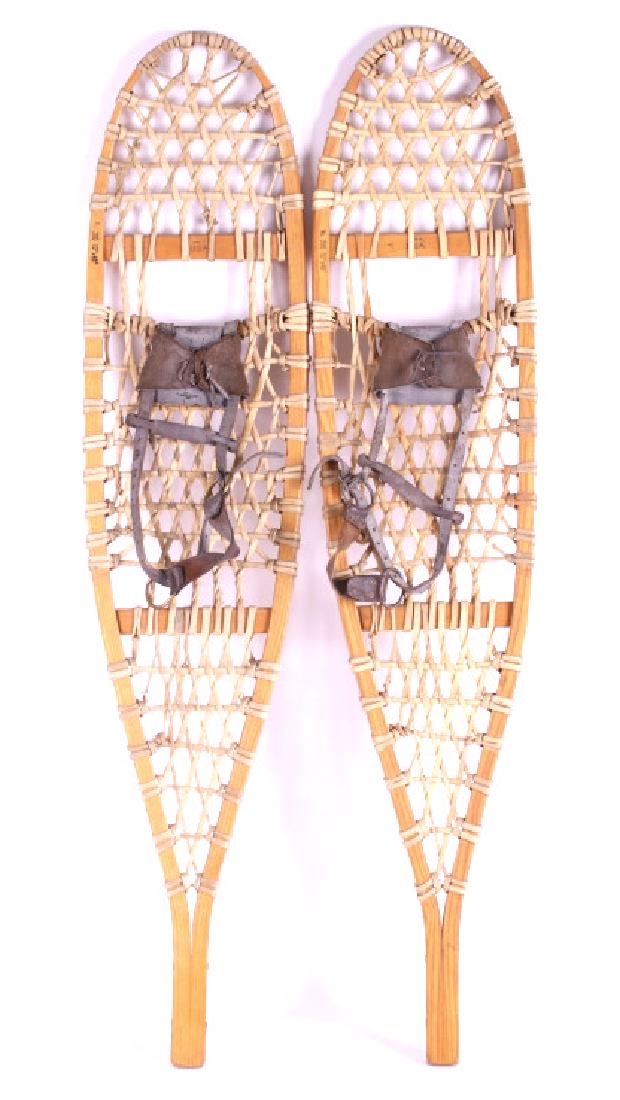 Antique Wooden Rawhide Snowshoes: For your consideration is a pair of Antique Wooden Rawhide Snowshoes. The snowshoes are marked "Made in the USA " and "No. 200 10" x 46." The shoes are constructed from what appears to be ash and rawh
