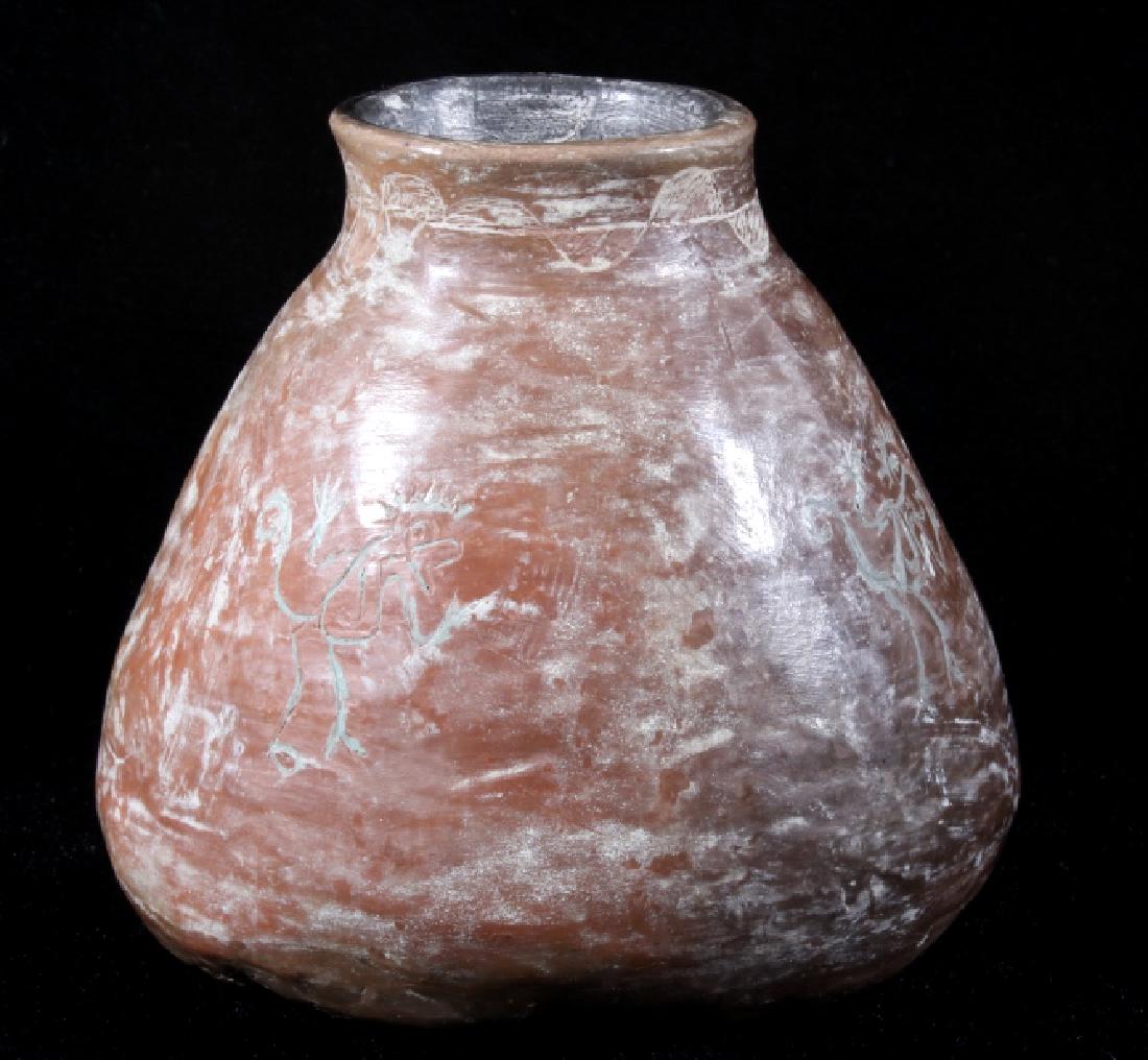 Mayan Style South American Glazed Pottery Jar: Offered in this lot we have a signed Mayan style South American glazed pottery jar. The jar is hand formed and shows the engraved images of monkeys around the middle of the jar and patterns across the