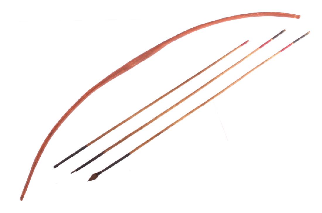 Sioux Polychrome Painted Bow & Arrows c. 1880-1890: The lot features a fantastic original authentic bow and arrow set from the Sioux Native American Indians dating to the 19th Century. The bow shows a hand carved solid wood construction that has been s