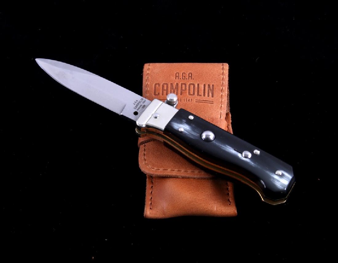 Campolin Buffalo Horn Italian Switchblade Knife: This is an imported Italian made Campolin switchblade knife. The knife has a hardened steel bayonet blade and features a genuine buffalo horn handle. The blade is marked on one side "A.G.A. Campolin M