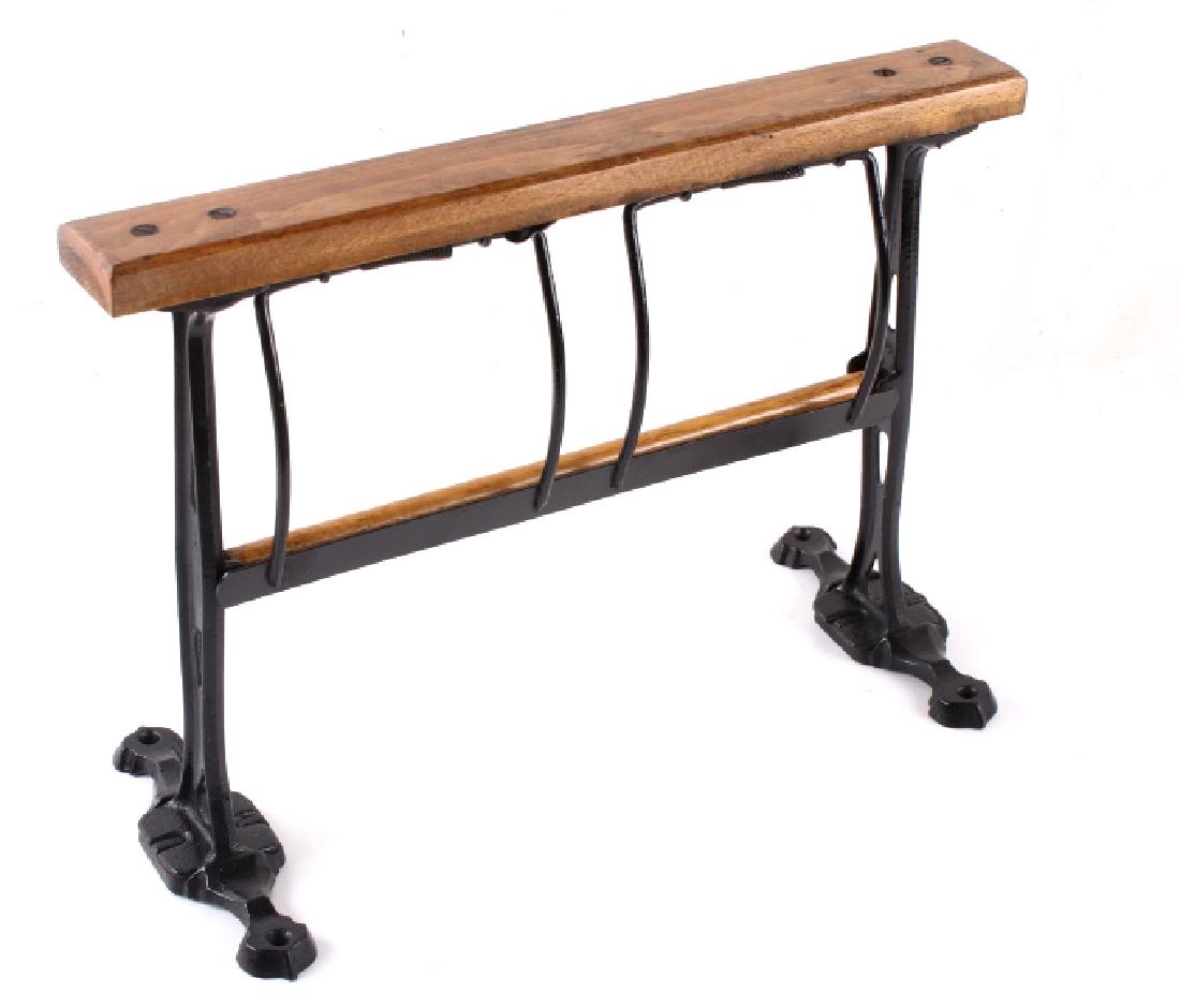 Paper Roll Dispenser and Cutter Desk Mount: Included in this lot we have a paper roll dispenser and cutter desk mount originating from the early to mid 20th century. The piece shows cast iron and wood construction. The holder is designed to all