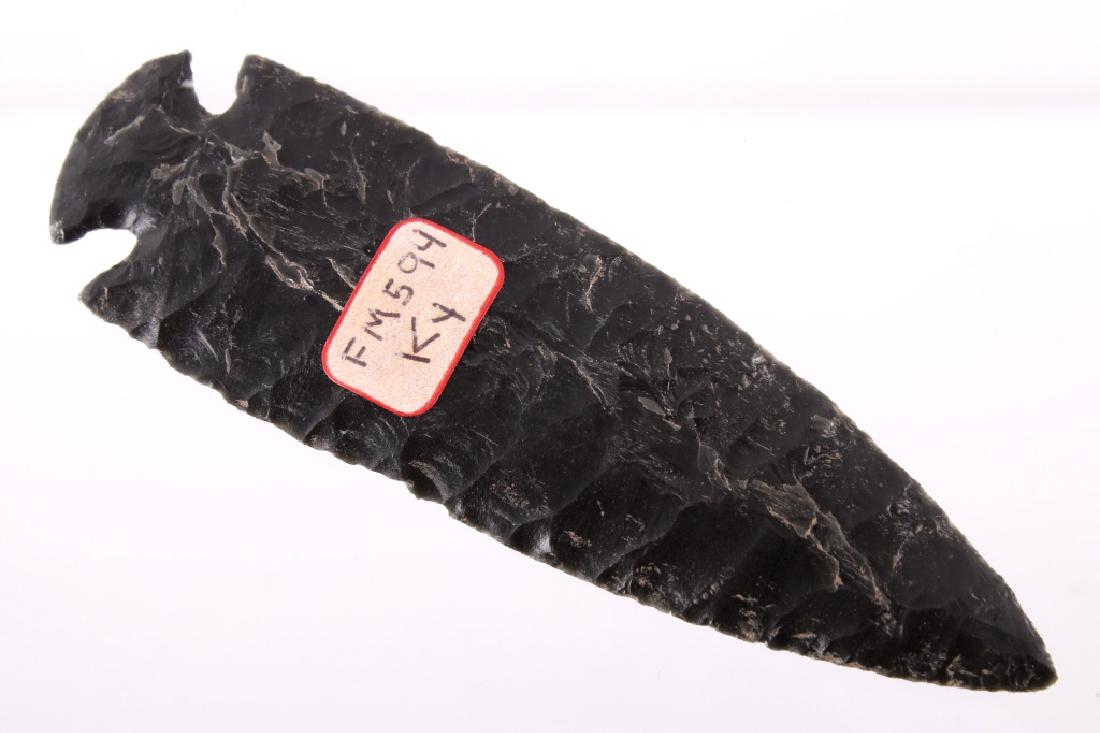Archaic Kentucky Dovetail Spear Point 9000-6000 BC: Available for sale is an exceptional ancient pre-historic notched dovetail or St. Charles long spear point. The point shows a deep beautiful black flint material and is in excellent well-preserved mus