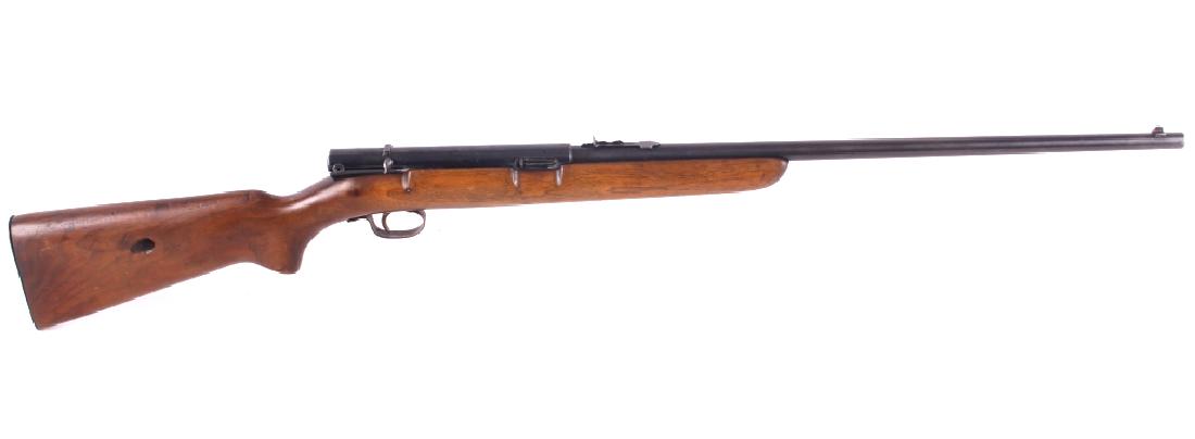 Winchester Model 74 .22 Long Semi-Automatic Rifle: This is a Winchester Model 74 semi-automatic rifle chambered in the .22 long caliber. The rifle has a blue'd steel round 21.5" barrel and receiver with a solid walnut hardwood stock and a butt stock f