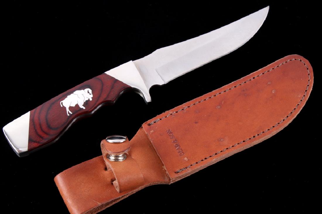 Bear & Son Silver Buffalo Inlaid Knife & Sheath: The lot features an original Bear and Son fixed blade hunting knife with leather sheath. The knife has been custom worked showing a beautiful solid silver inlaid Great American Bison Buffalo figure on