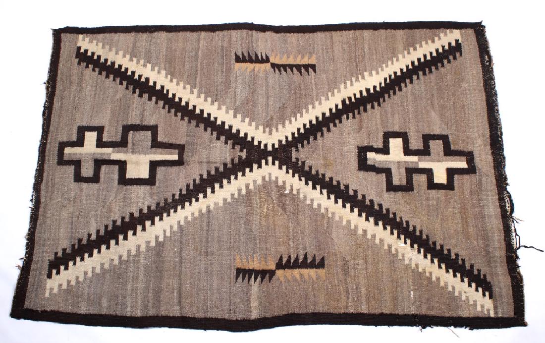 Navajo Ganado Hubbell Trading Post Rug c. 1900: Featured in this lot we have a Navajo Native American Ganado hand woven rug originating from the early 1900's. The rug is from the famed Hubbell Trading Post showing a solid tightly hand woven Navajo-