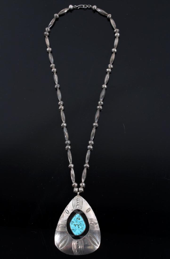 Silver & Turquoise Navajo Shadow Box Necklace: For your consideration in this lot we have a sterling silver and turquoise Navajo Native American shadow box necklace. The piece shows a single large number 8 turquoise cabochon, set into a shadow box