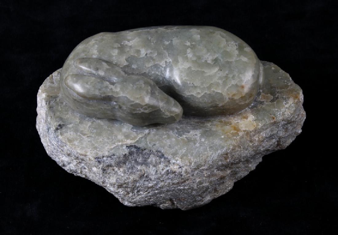 Green Foliated Talc Sleeping Doe Carving: Featured in this lot we have a Ray Jones Talc Soapstone sleeping doe carving. The sculpture depicts an intricately carved sleeping Doe curled up on an unpolished base. The carving is in excellent cond