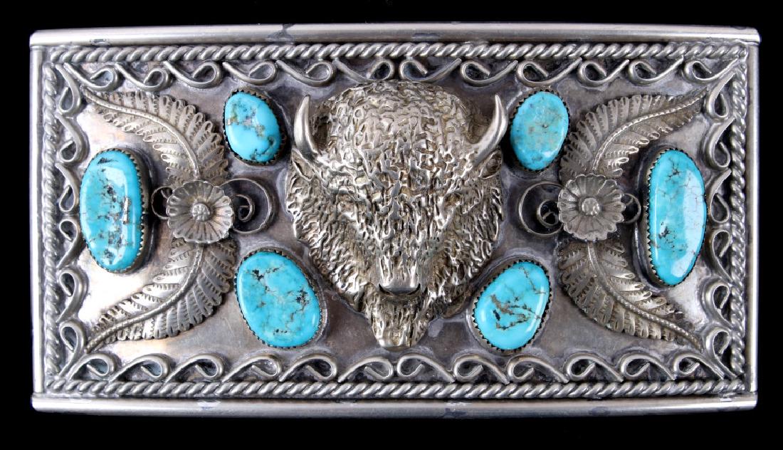 Navajo Large Sterling Buffalo & Turquoise Buckle: Included in this lot is a signed Navajo Native American sterling silver buffalo and Morenci turquoise belt buckle. This large solid sterling piece features six Morenci turquoise cabochons. The focal p