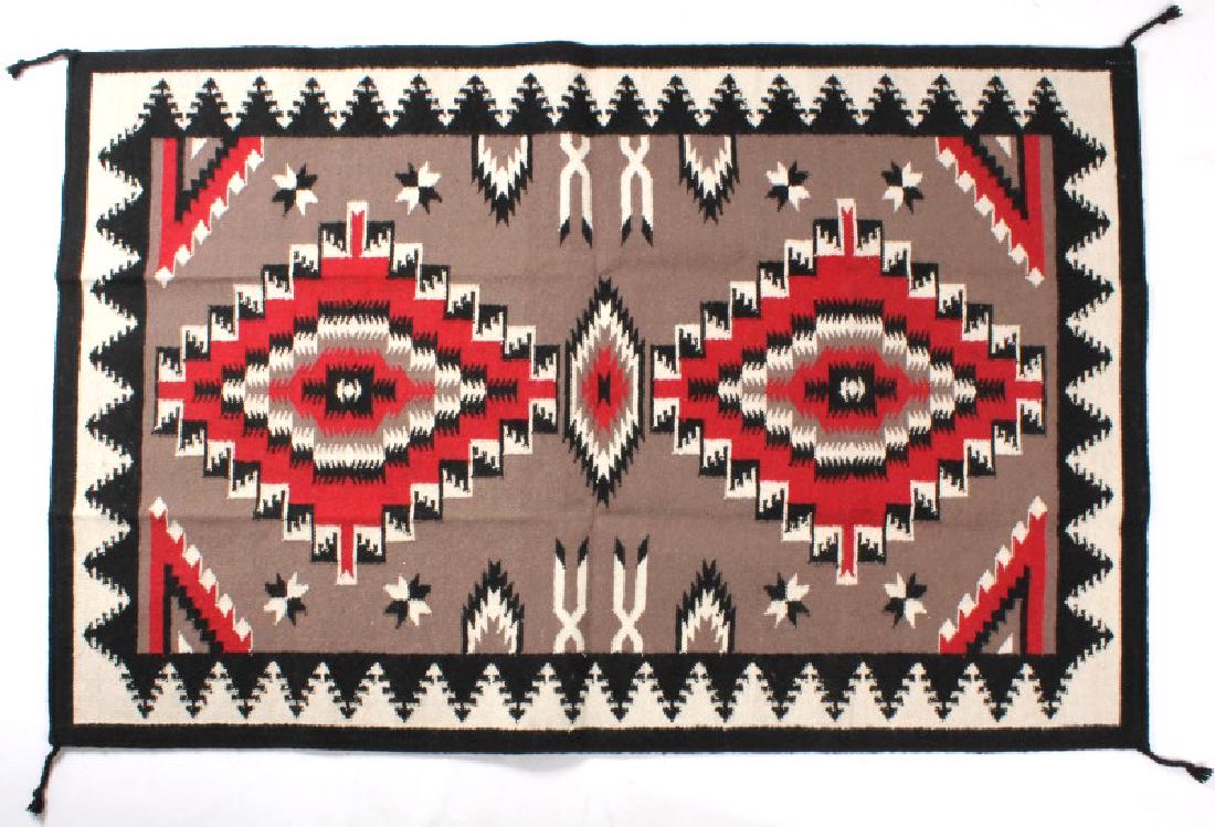 Navajo Ganado Pattern Style Large Wool Rug: The lot features a vertical loom hand knotted wool rug in a very rare large Navajo Native American Indian Ganado Pattern style. The wonderful large size collectible floor covering shows the Ganado Pat