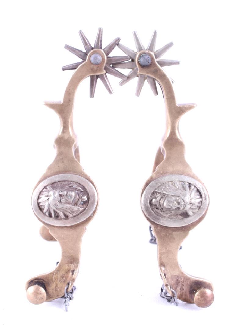 Buermann Hercules Bronze Indian Chief Head Spurs: For your consideration is a pair of Buermann Hercules Bronze Indian Chief head spurs. August Buermann immigrated to the US from Germany in 1864. After fighting in the Civil War Buermann returned to Ne