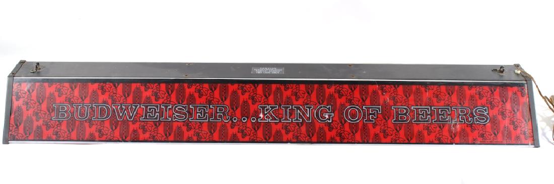 1970's Budweiser King Of Beer Pool Table Light: Offered in this lot we have a Budweiser King of Beer pool table advertising light originating from the 1970's. The light shows a metal frame with colored plastic sides. The sides display a red backgro