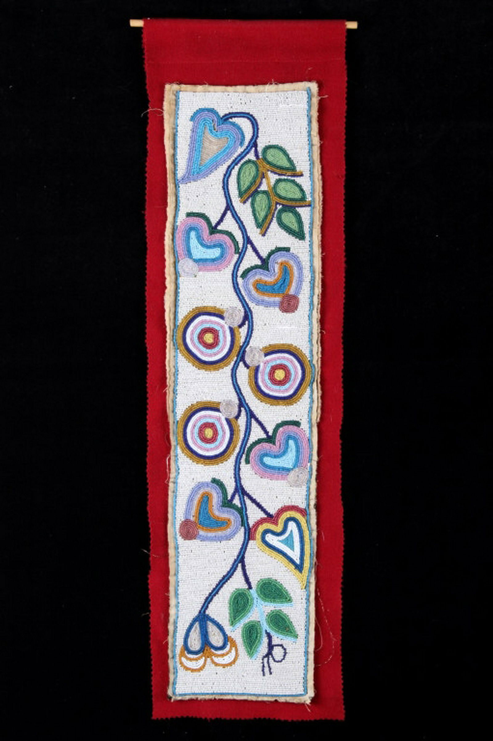 Ojibwe Fully Beaded Whimsical Panel 19th Century: This is an exceptional fully beaded panel from the Ojibwe (Ojibwa) Native American Indians and dating to the 19th Century. The panel, of a nice large to medium size, shows a red trade clothe wool cons