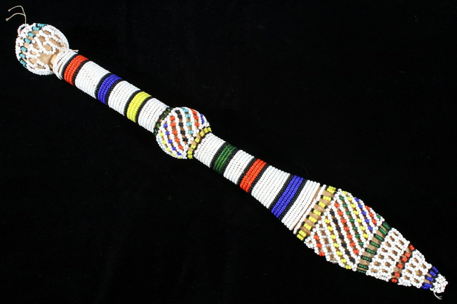Native American Fully Beaded Dancing Wand: Included in this lot we have a Native American fully beaded ceremonial dance wand originating from the early to mid 20th century. This dancing stick shows wonderful tight beadwork and detailed pattern