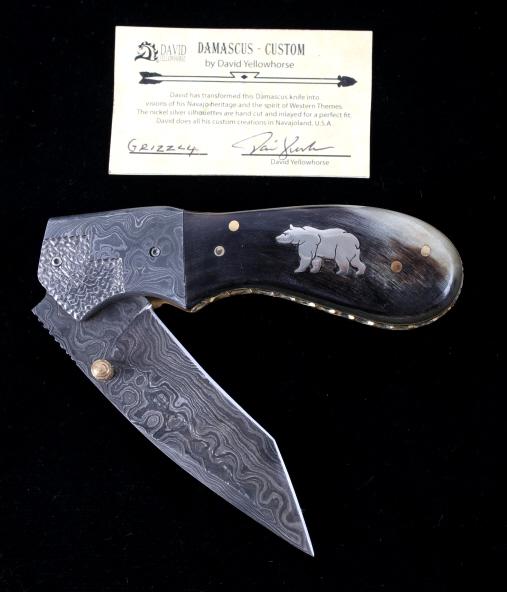 Navajo Yellowhorse Damascus Silver Grizzly Knife: We are proud to be one of the exclusive knife makers to offer David Yellowhorse custom Damascus pocketknives (pocket knives). David Yellowhorse has transformed this Damascus knife into visions of his