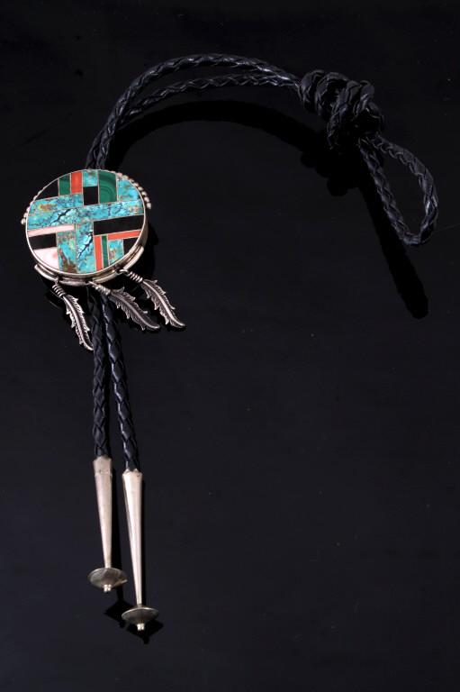 Navajo Kingman Turquoise Sterling Inlaid Bolo Tie: For your consideration is a signed Navajo Native American Inlaid and Kingman Turquoise sterling silver bolo tie. The tie is constructed with a braided leather chord and sterling silver aglet tips. The