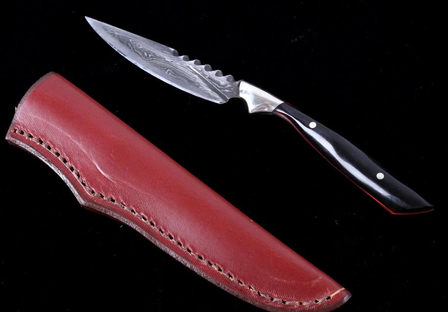 Chris Peterson Utah Damascus & Buffalo Knife: This is an original handmade Damascus forged steel knife and leather scabbard from Christ Peterson. The knife features a wonderful custom blacksmith forged folded Damascus steel blade that has been pa